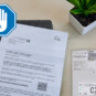Schreiben der DMG neben einem Smart Meter mit einer warnenden Hand davor